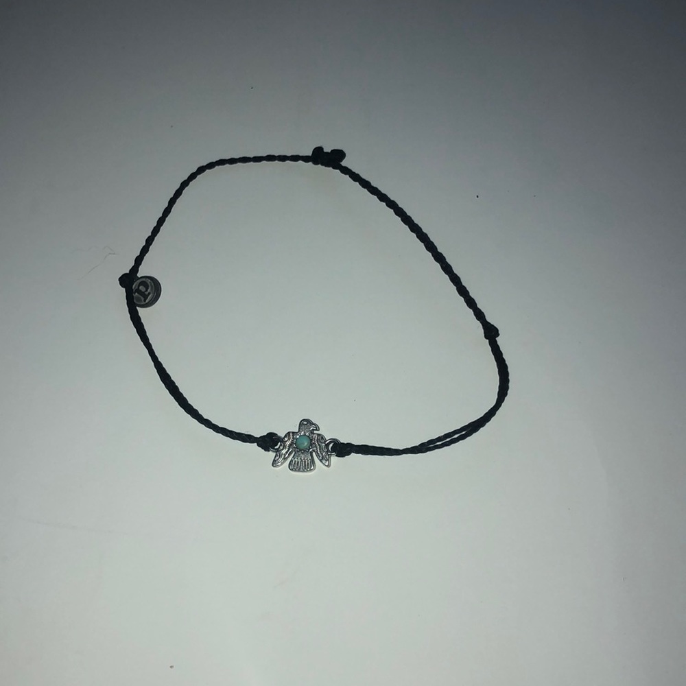 Black pura vida bracelet with bird charm
